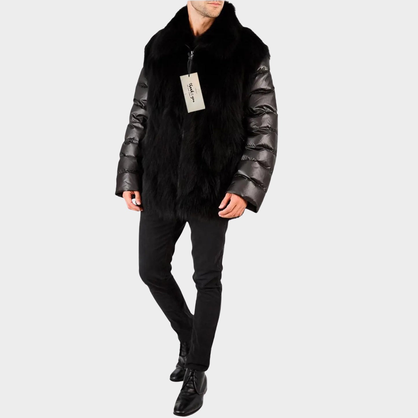Person wearing a black puffer jacket with fur trim on a light gray background
