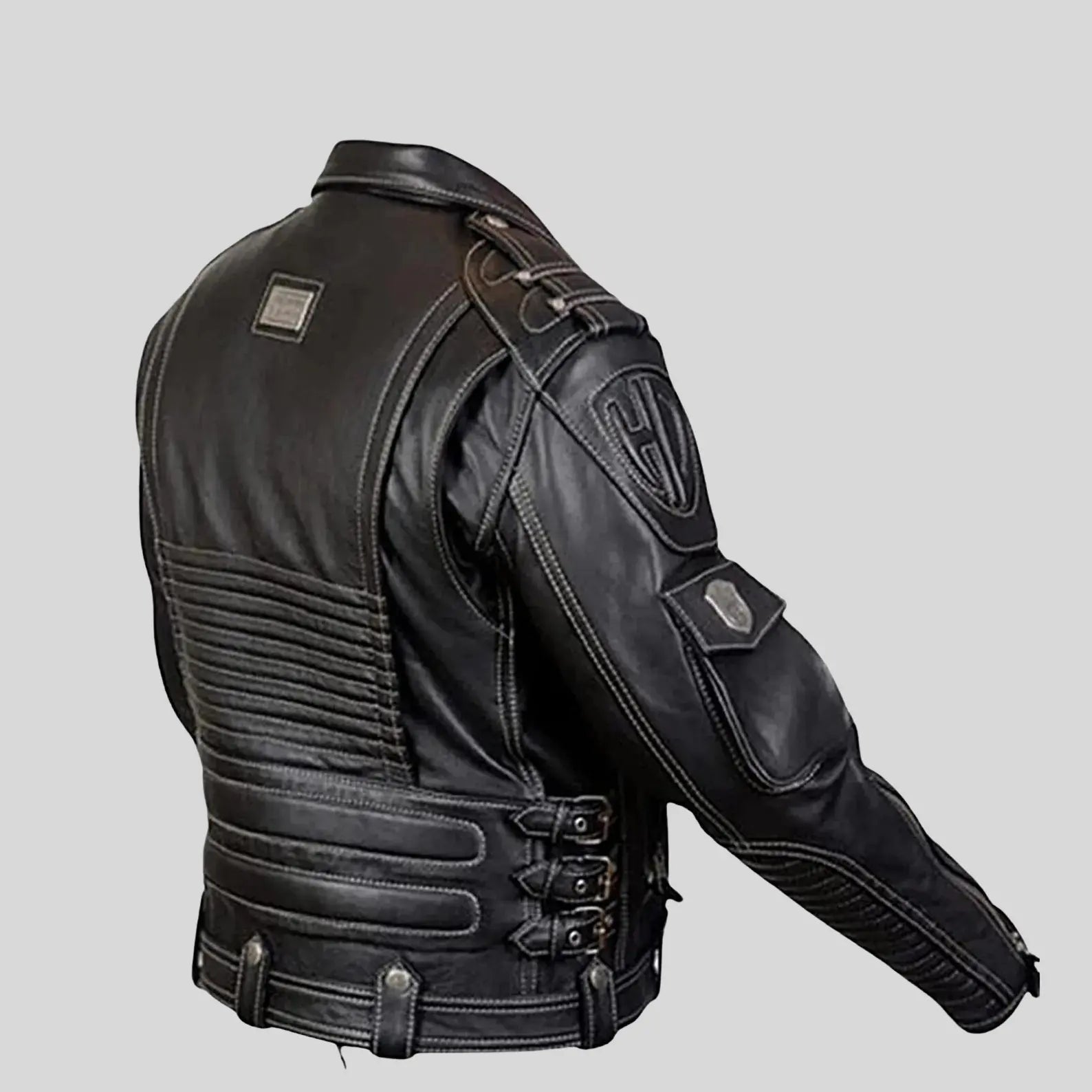 Black leather jacket with stitching details on a gray background