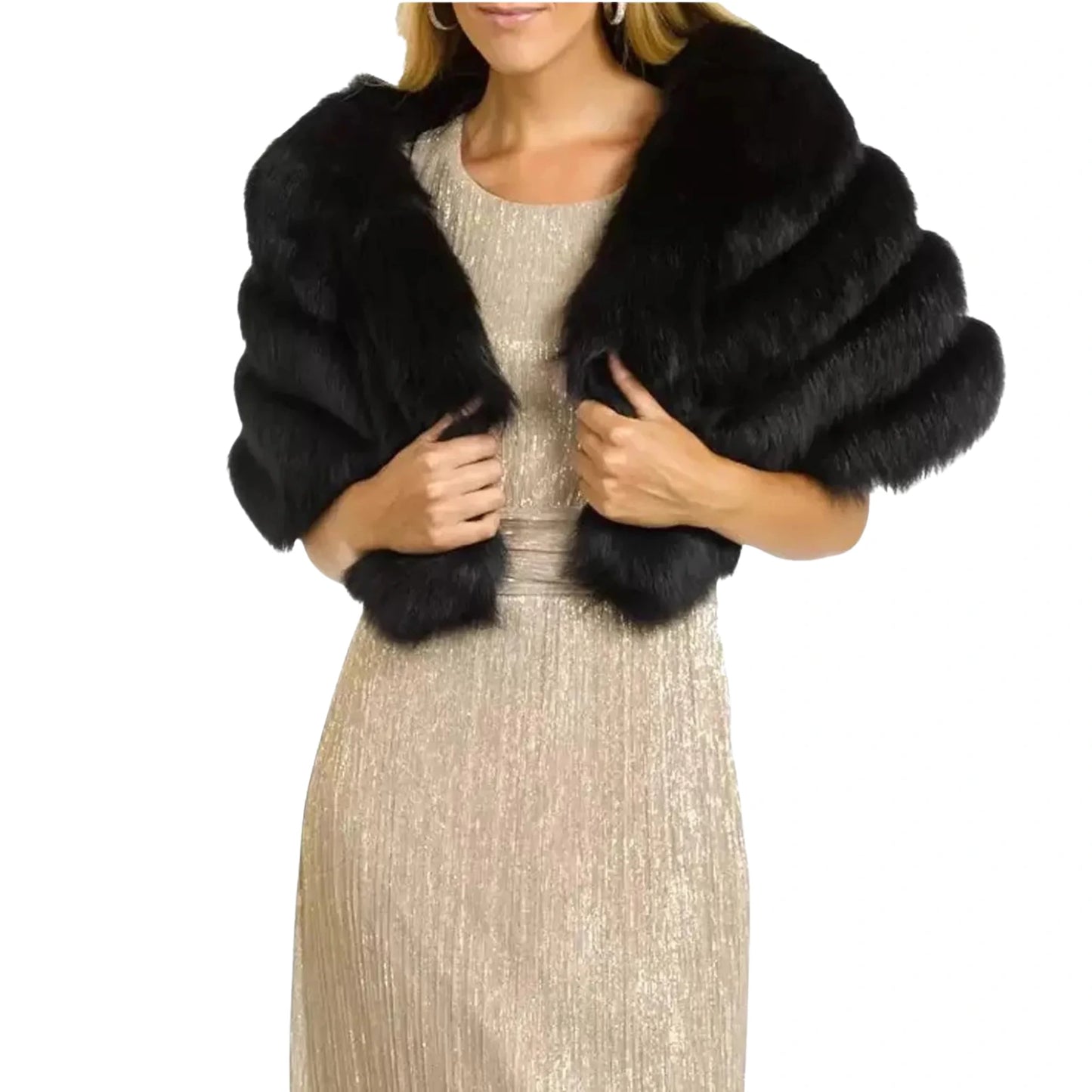 Black fur shrug over a beige dress on a white background
