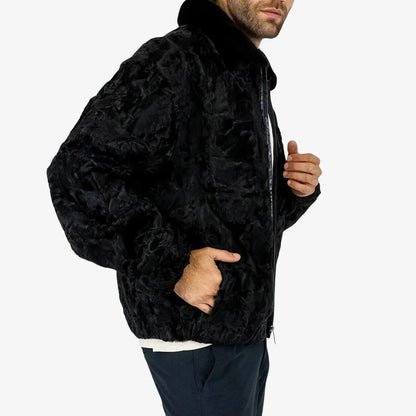 Person wearing a black textured jacket on a white background