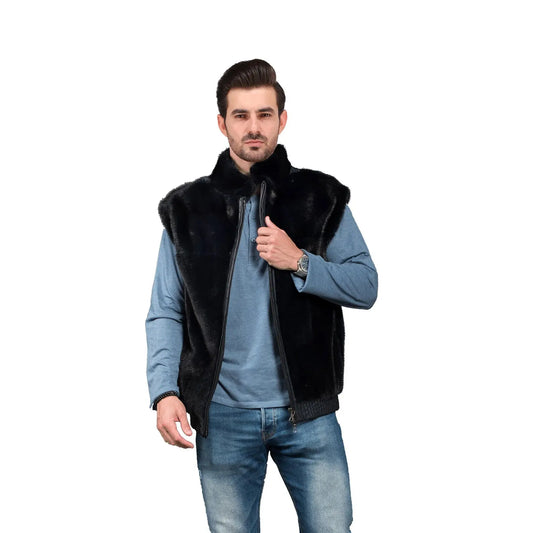 Man wearing a black fur vest over a blue shirt on a white background
