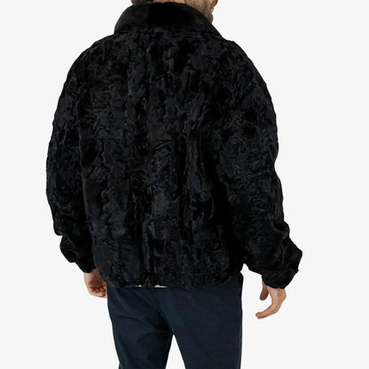 Black fur jacket worn by a person on a white background