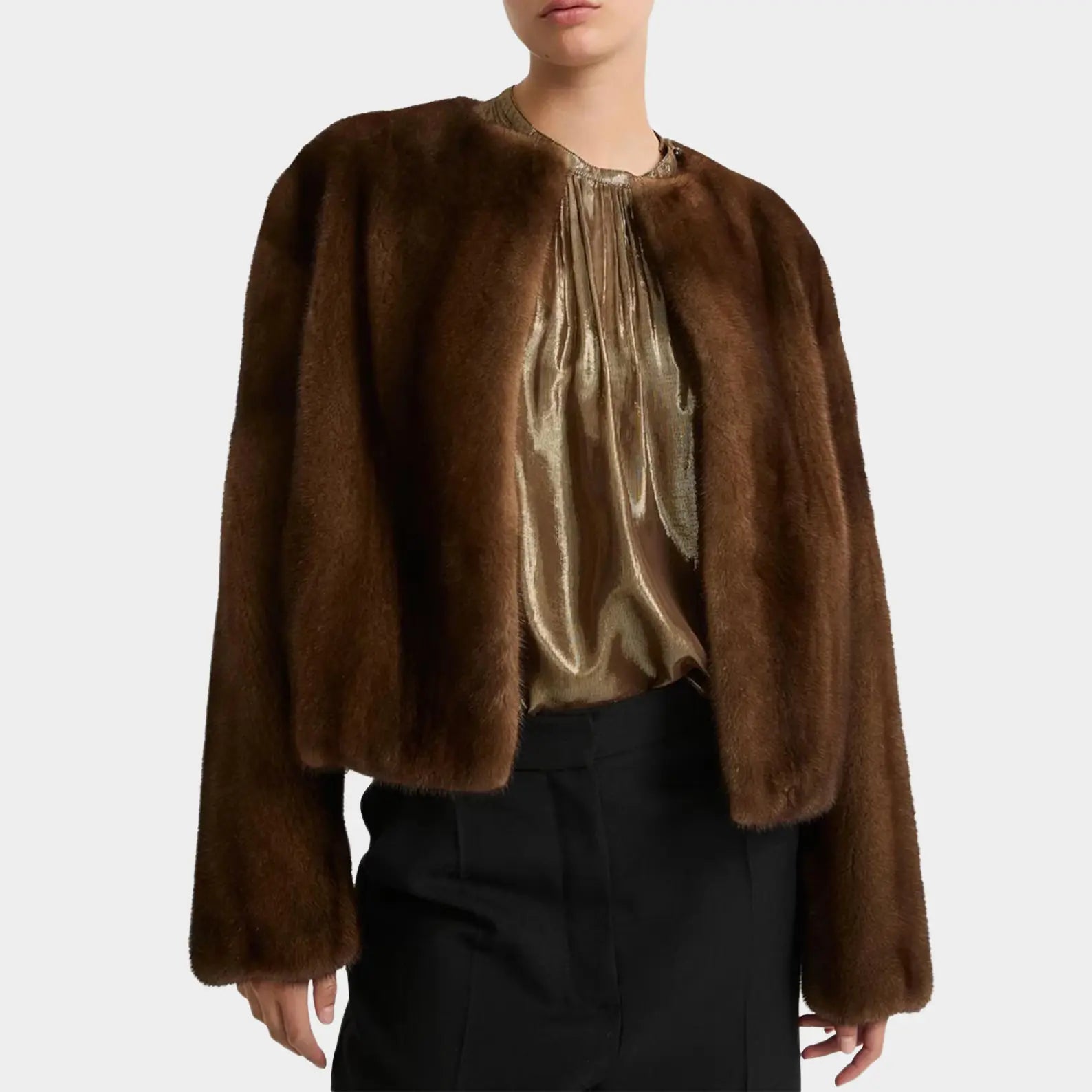Brown fur coat worn by a person on a white background