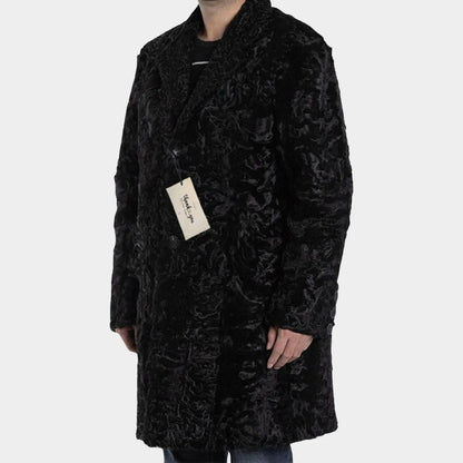 Black textured coat worn by a person on a white background