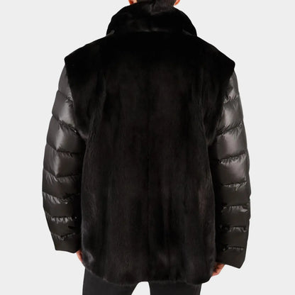 Black puffer jacket with fur trim on a white background