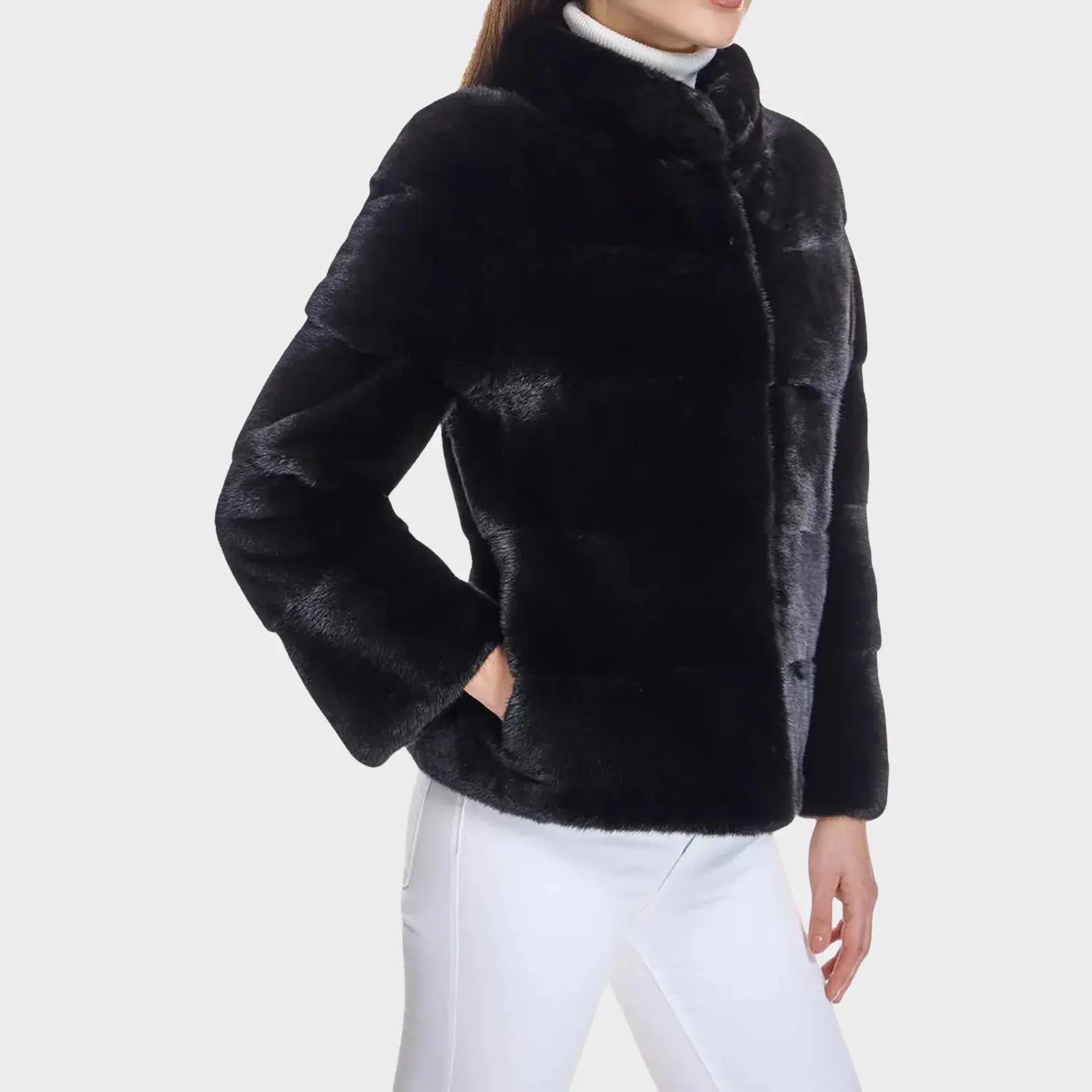 Black fur jacket worn by a person on a white background