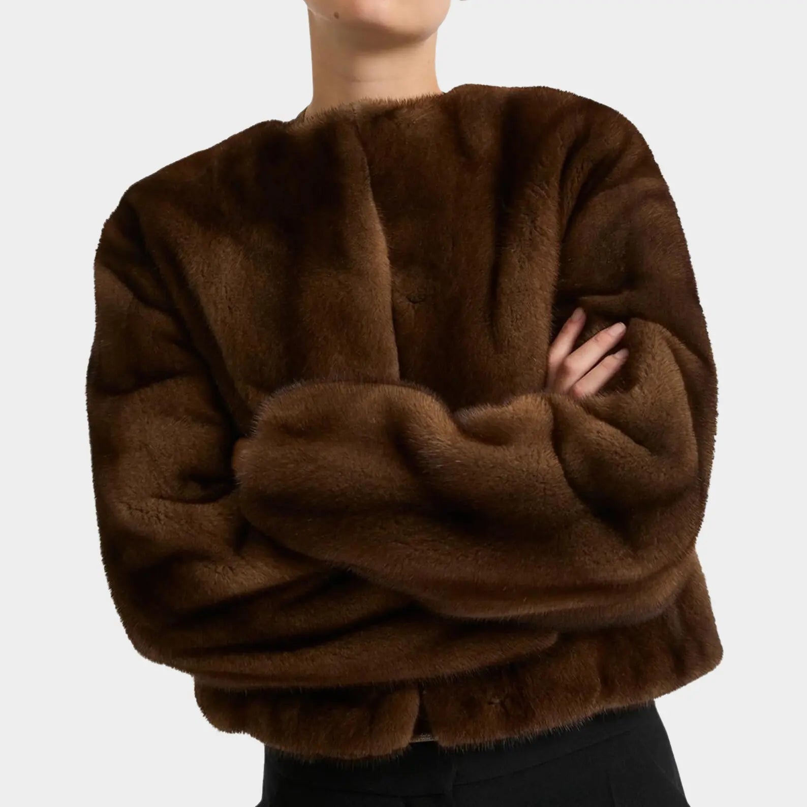Brown fluffy sweater worn by a person on a plain background