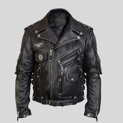 Black leather jacket with patches on a gray background