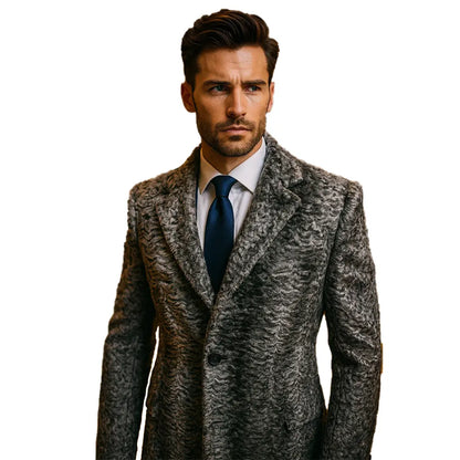 Man wearing a patterned suit jacket with a blue tie on a white background