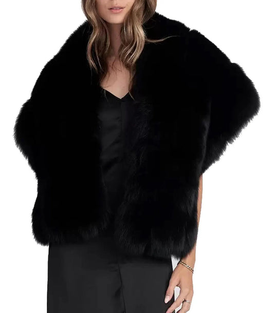 Black fur vest worn by a model on a white background