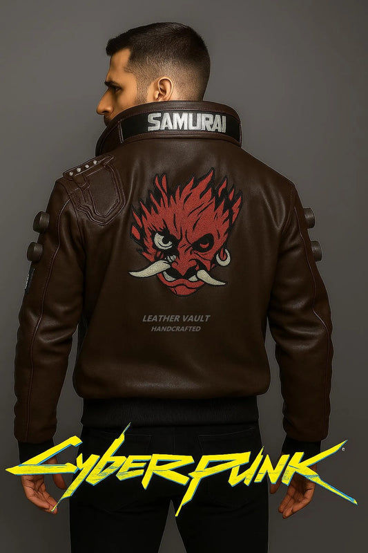 Person wearing a brown leather jacket with a red face design and 'Samurai' branding, on a gray background.