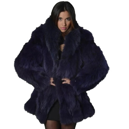 Woman wearing a dark blue fur coat on a white background