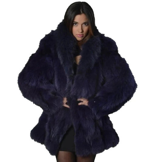 Woman wearing a dark blue fur coat on a white background
