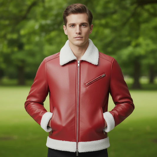 Man wearing a red leather jacket with white fur trim standing in a park.